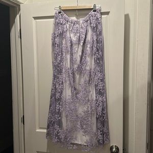 Cape dress with elastic neckline.